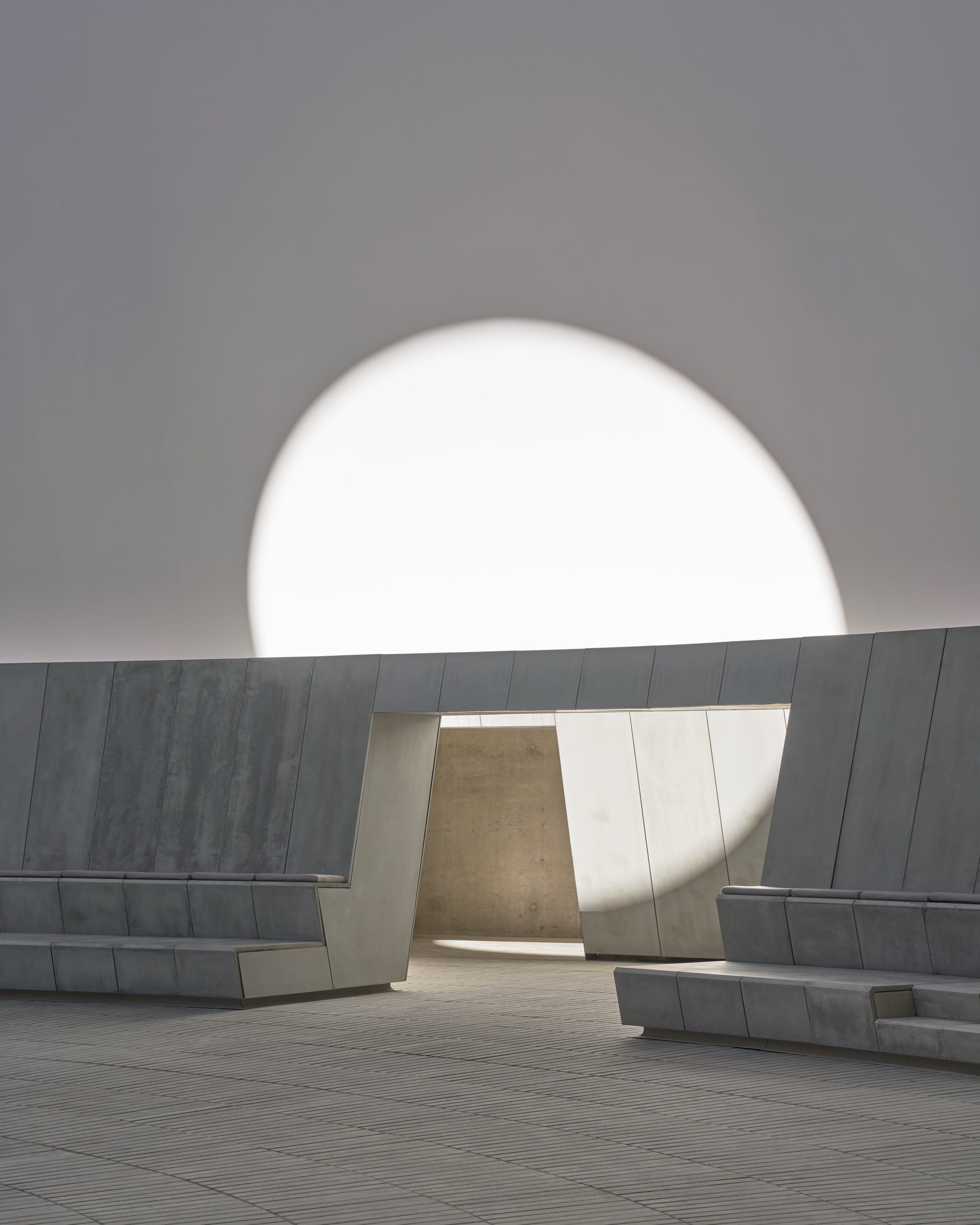 Bench and luminous sphere inside James Turrells As Seen Below