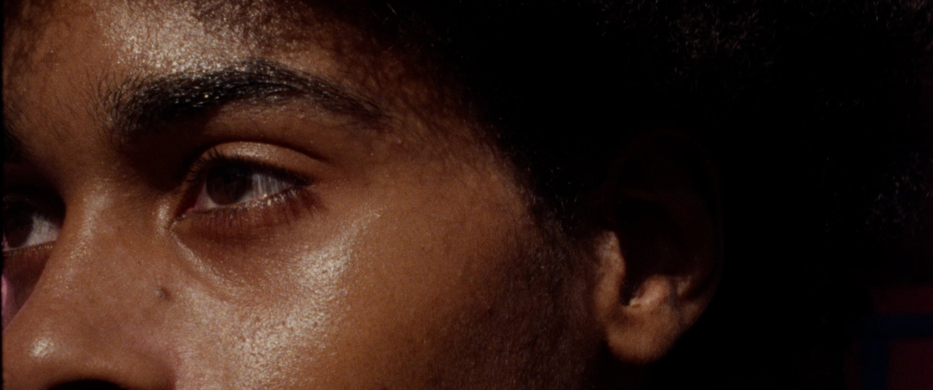 Close-up film still of a woman from the Now Burns Blue book trailer