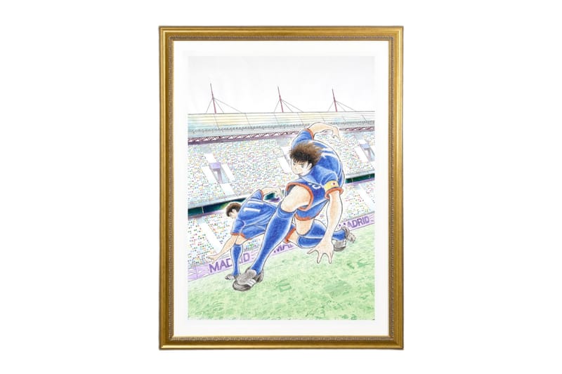 Framed Captain Tsubasa artwork showing a football player controlling the ball during a match in a large stadium