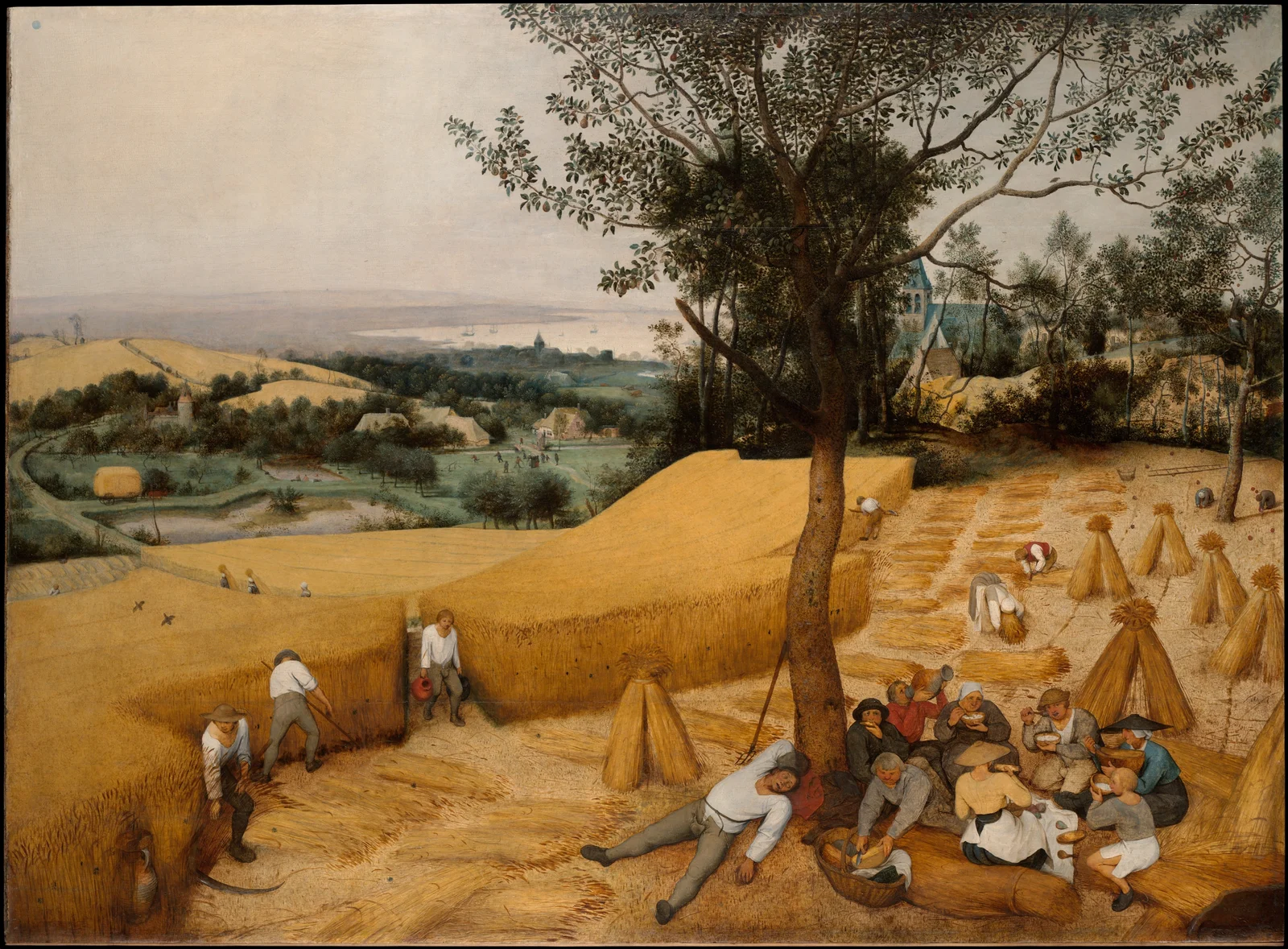 Harvesters cut golden wheat while a group rests beneath a tree, with a village and water in the distance.