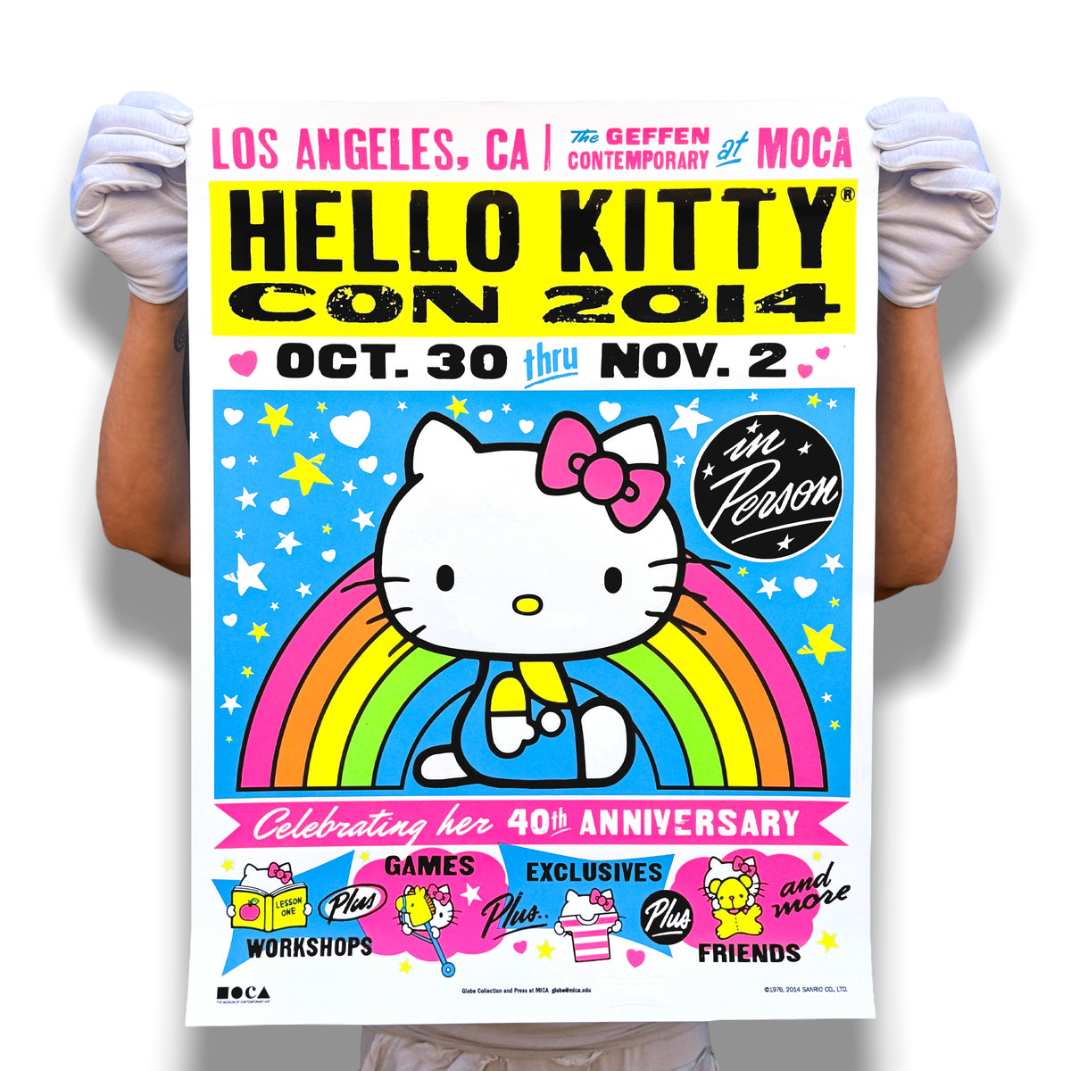 A person wearing white gloves holding the 18-by-24-inch Hello Kitty Con LA 2014 screen print
