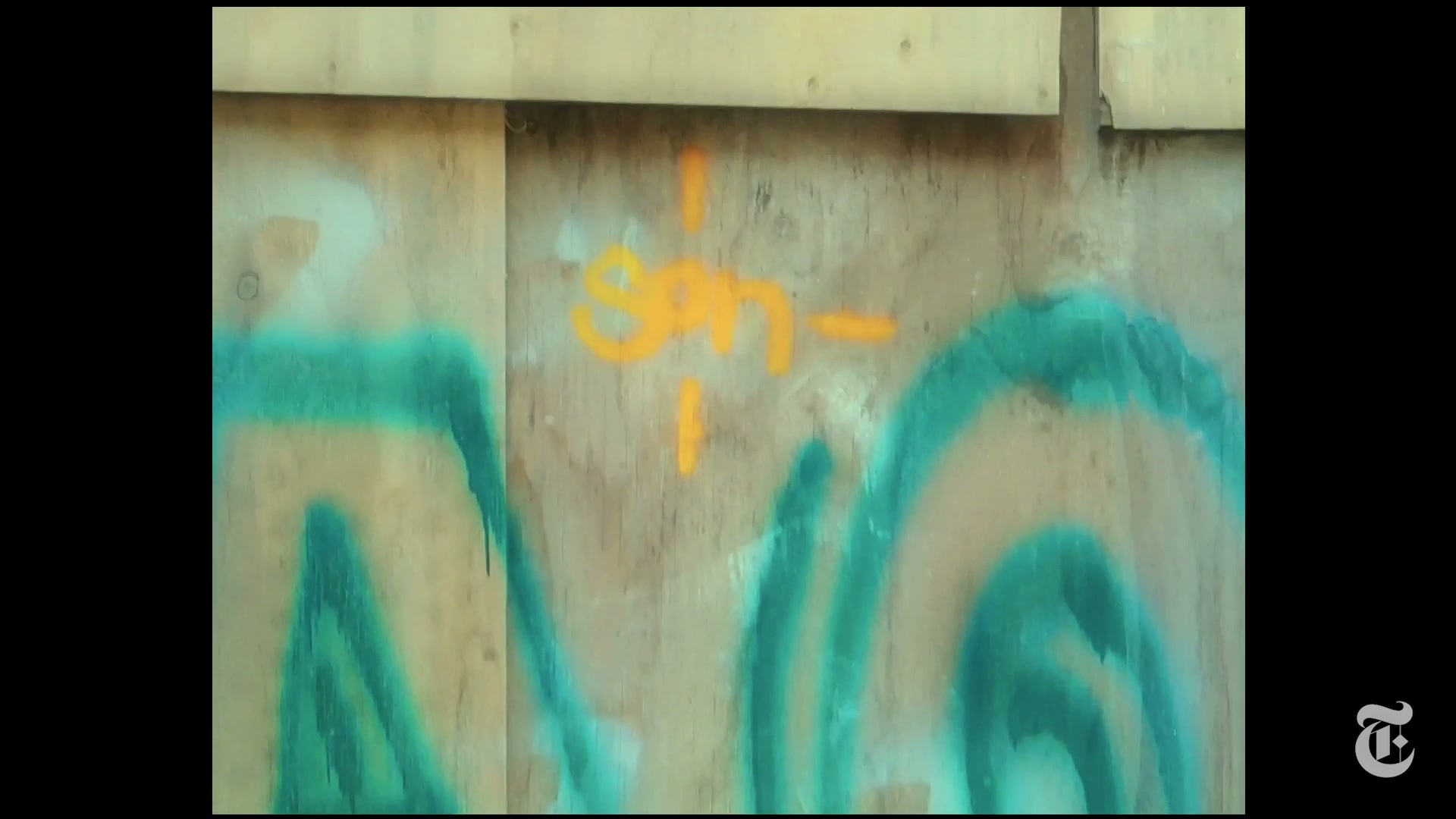 An orange SON tag painted beneath a larger turquoise Maoz graffiti tag on a Stockholm wall