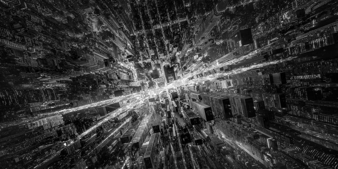 A monochrome aerial panorama turns the streets and towers around Times Square into a radiating urban pattern